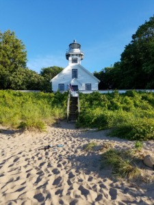 Photo of sandy beach in front of Old Mission Lighthouse